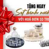 Quà tặng tri ân: set bình ly thủy tinh sang trọng, khay đen viền vàng, và bộ bình trà.